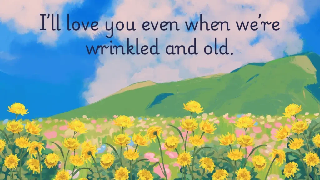 100 Short Love Messages to Send Daily - Fresh Love Texts A romantic message over a vibrant spring landscape with green hills, blue sky, and fluffy clouds. Bright yellow flowers bloom in the foreground. The message in dark blue text reads: "I’ll love you even when we’re wrinkled and old." The image evokes warmth, anticipation, and affection.
